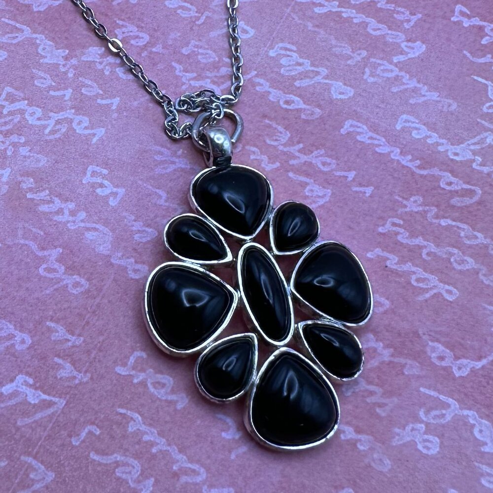 LC signed vintage silver-tone and black “flower” pendant.